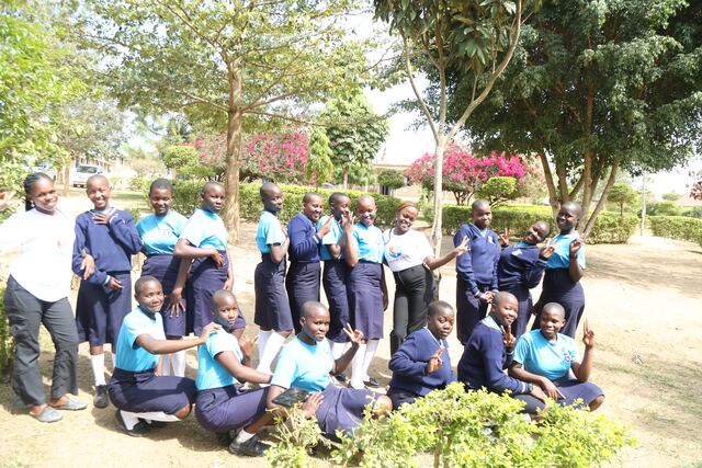 A group of students gathered outdoors at school